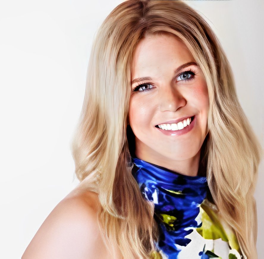 Smiling woman with long blonde hair.